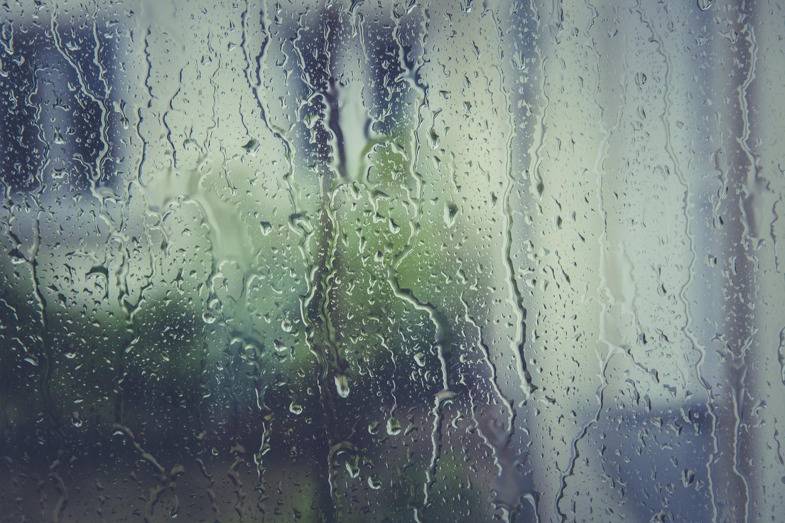 Premium Photo  Vertical natural background condensation on glass with  drops flowing down humidity and foggy blank outside bad weather rain